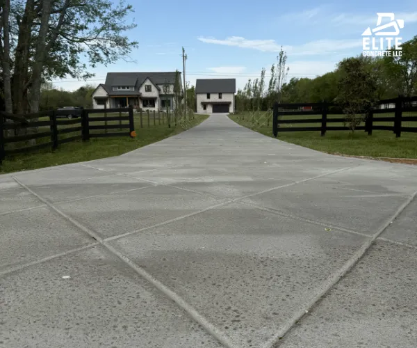 A freshly poured and smooth concrete driveway