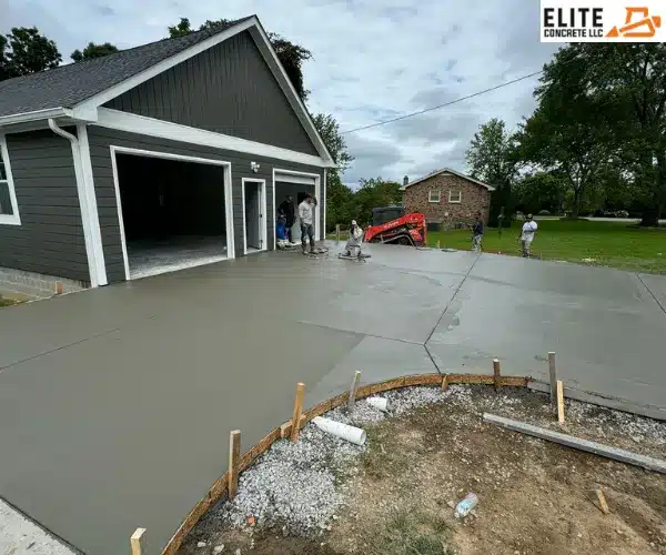 A newly built, detached multi-car garage structure with clean light-colored siding